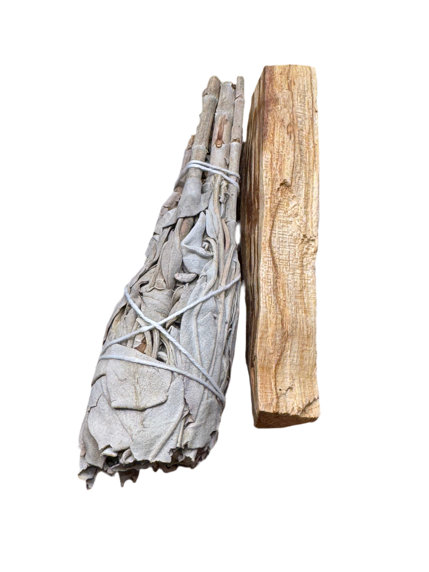 Bundled sage sticks with a wooden tool on a white background